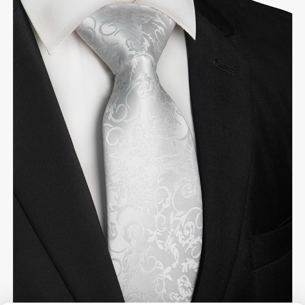 Elegant Black Suit with White Patterned Tie